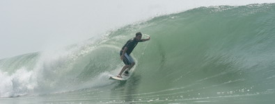 image: Chuck Taylor stands his ground in a TS Barry-generated barrel on Pensacola Beach, Gulf Coast, Florida