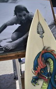 image: photo of the late Matt "Critter" Martin and one of his surfboards