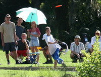 image: the tournament winner, Corey from Jacksonville, drives on the final hole