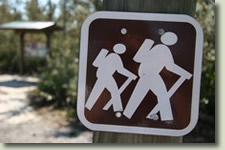 image: hiker sign near Garcon Point South Loop trailhead